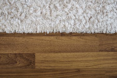 Carpet on a teak wood floor make a perfect floor experience